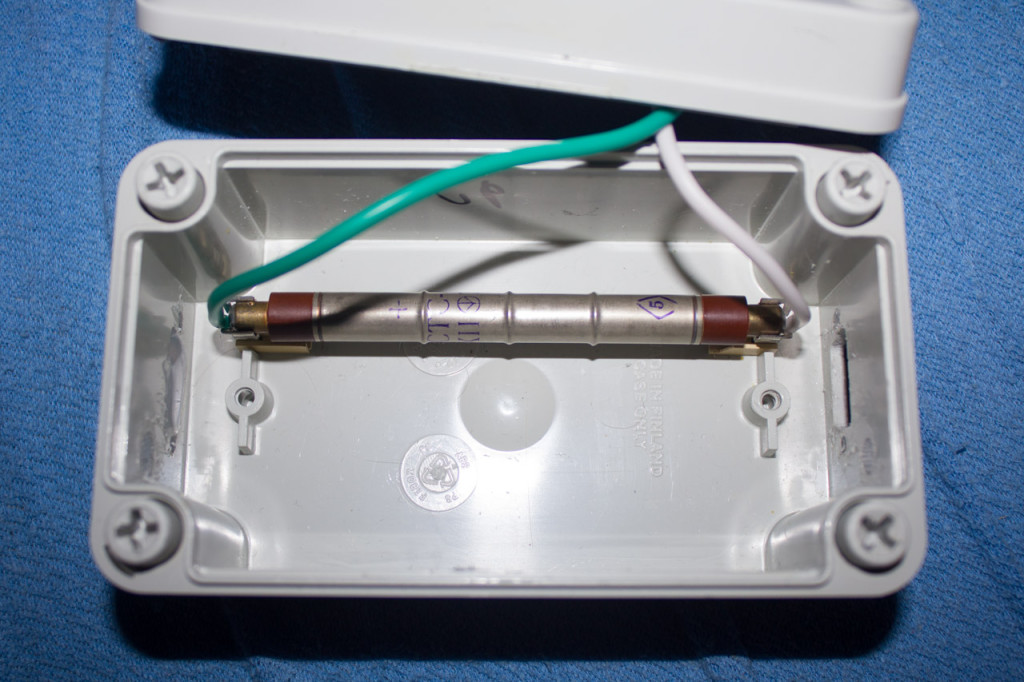 Tube mounted in case. Thick silicone leads are to minimize the leak current